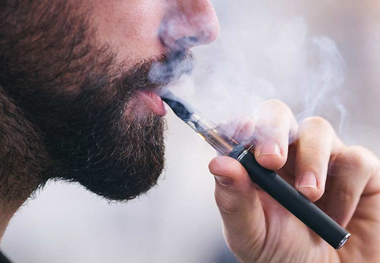 a person using e-cigarettes